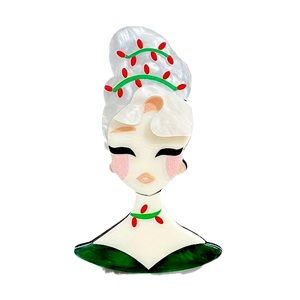 Retro looking acrylic holiday brooch.